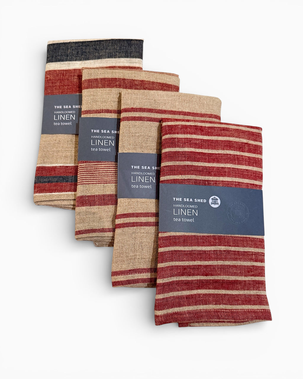 Set of striped linen towels with labels on a white background. Striped linen tea towel
100% linen tea towel
Hand-loomed linen tea towel
Natural linen kitchen towel
Coastal linen tea towel
Linen dish towel UK