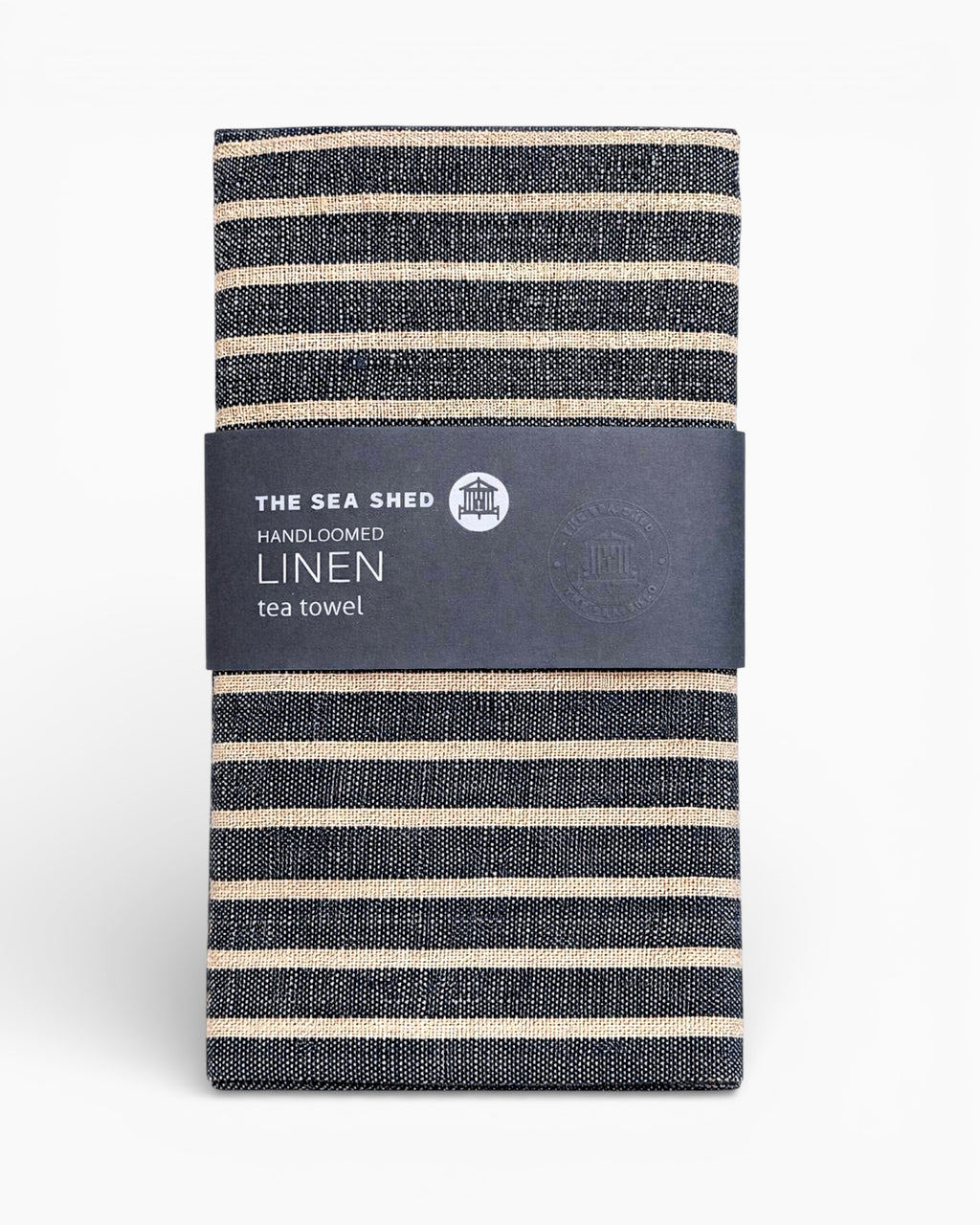 Striped linen tea towel with 'The Sea Ship' label on a white background.Striped linen tea towel
100% linen tea towel
Hand-loomed linen tea towel
Natural linen kitchen towel
Coastal linen tea towel
Linen dish towel UK