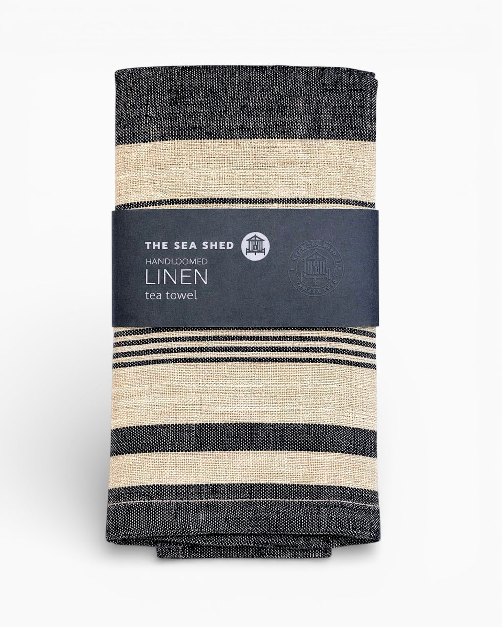 Striped linen tea towel with 'The Sea Shed' label on a white background. Striped linen tea towel
100% linen tea towel
Hand-loomed linen tea towel
Natural linen kitchen towel
Coastal linen tea towel
Linen dish towel UK