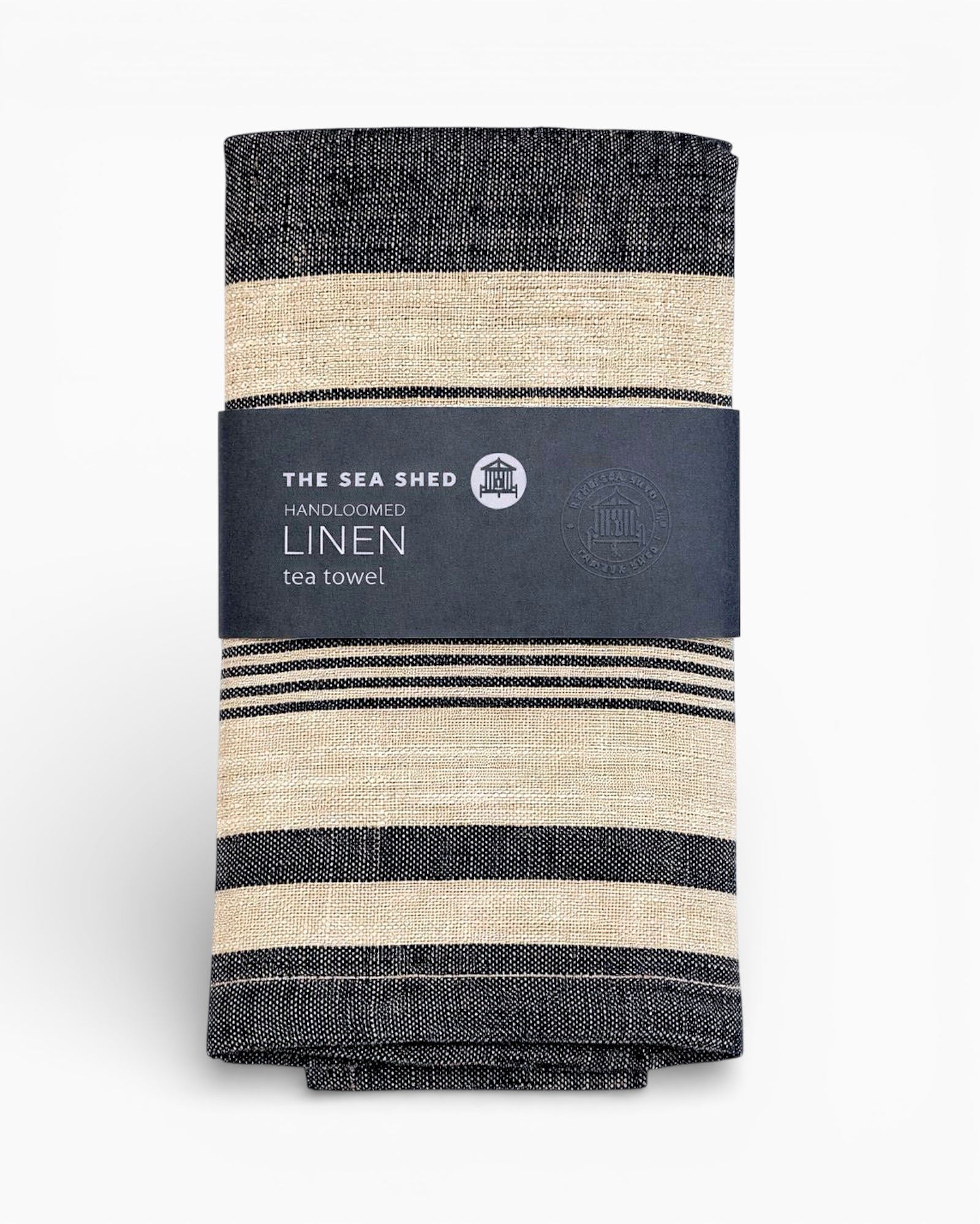 Striped linen tea towel with 'The Sea Shed' label on a white background. Striped linen tea towel
100% linen tea towel
Hand-loomed linen tea towel
Natural linen kitchen towel
Coastal linen tea towel
Linen dish towel UK