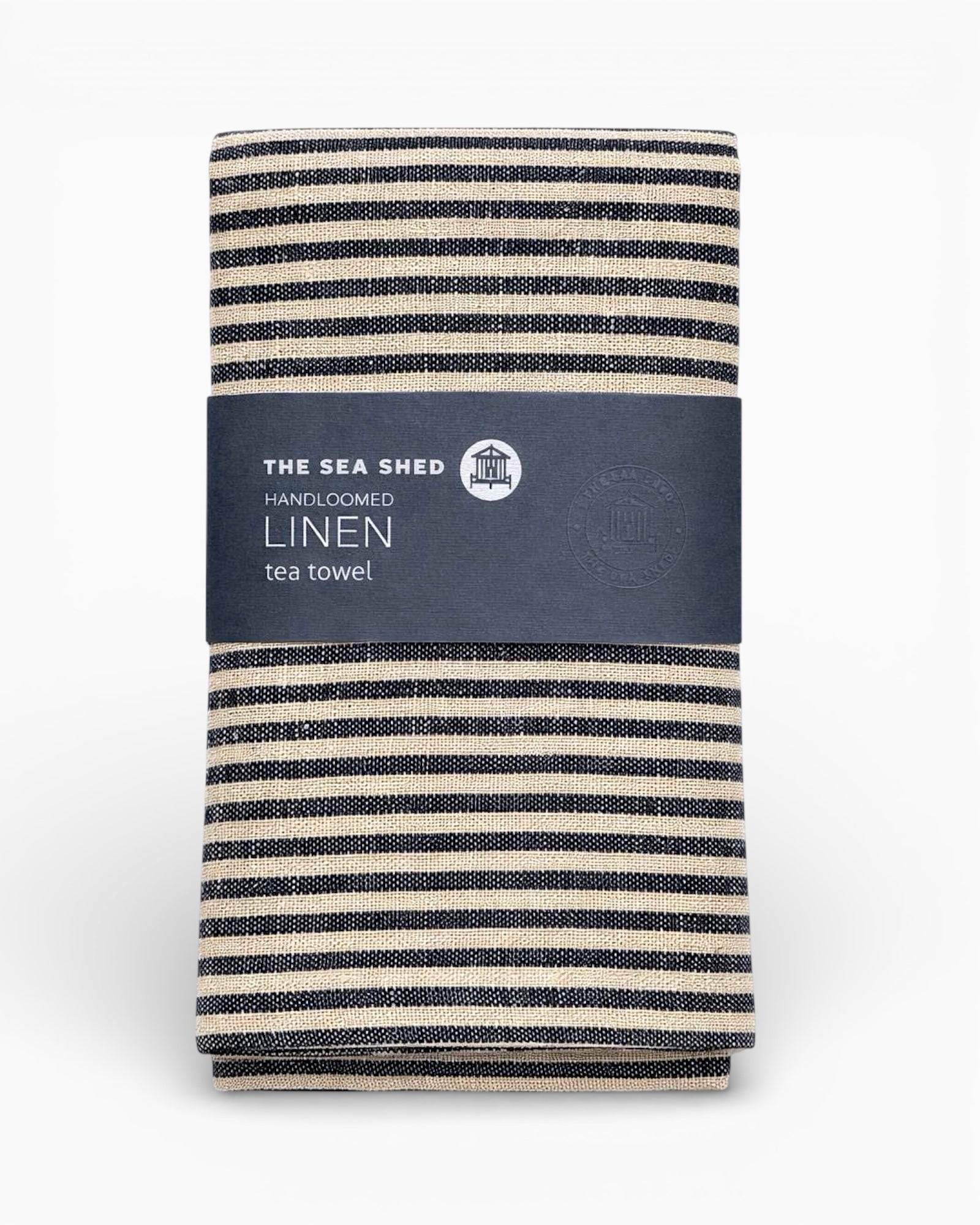 Striped linen tea towel with 'The Sea Shed' label on a white background. Striped linen tea towel
100% linen tea towel
Hand-loomed linen tea towel
Natural linen kitchen towel
Coastal linen tea towel
Linen dish towel UK